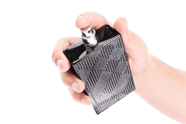 Male hand holding a black perfume bottle — Stock Photo, Image