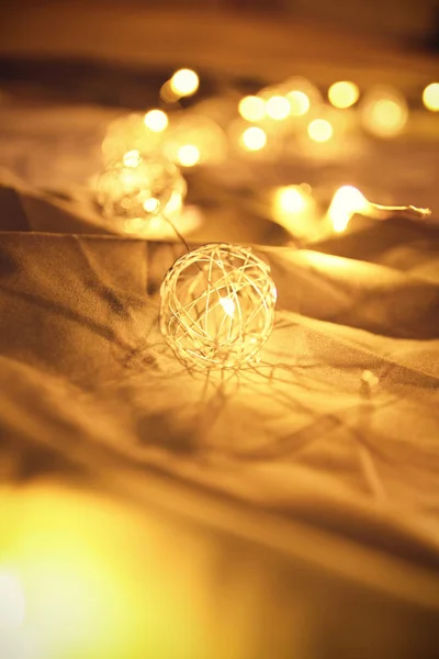 Close Shot Blurred Golden Christmas Lights Rumpled Bed Sheets Making — Stock Photo, Image