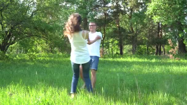 A young family is waiting for a child. A man kisses his pregnant wife. — Stock Video