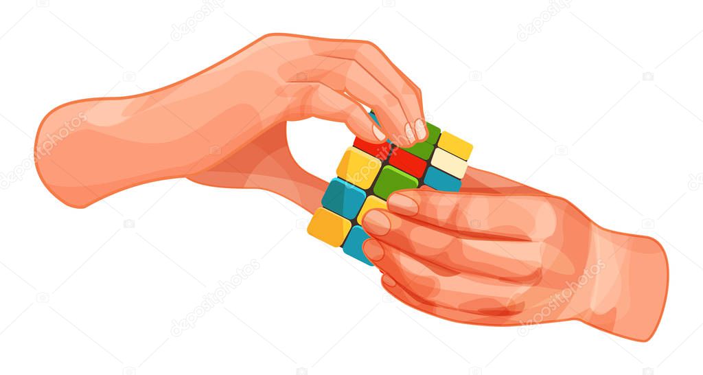 Hands hold colorful gaming cube with colored squares.