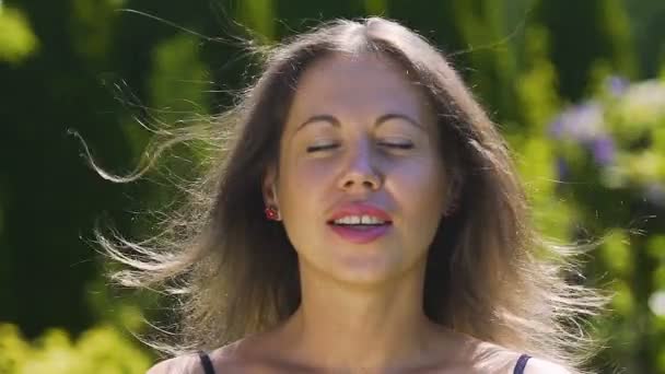 Female Enjoys Herself Wind Blows Hair Eyes Close Happiness Joy — Stock Video