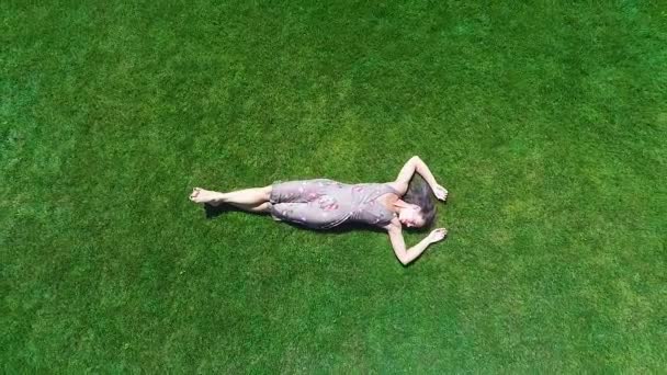 Aerial View Woman Lying Green Grass Enjoys Life Feels Happy — Stock Video