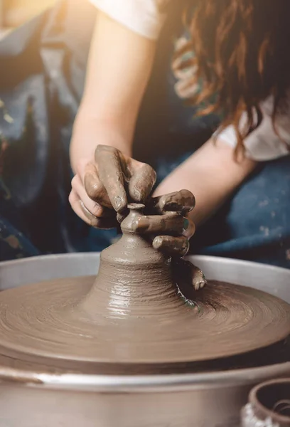 Artisan pottery woman making a small pot