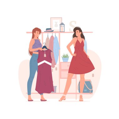 Mağazada birlikte kıyafet seçen kadın arkadaşlar.