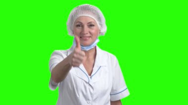 Gülümseyen Doktor başparmak tabela gösteriliyor.