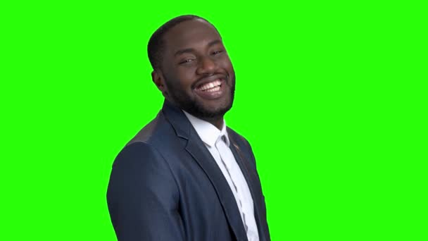 Smiling macho-man on green screen. — Stock Video