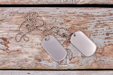 Empty silver dog tags close up.