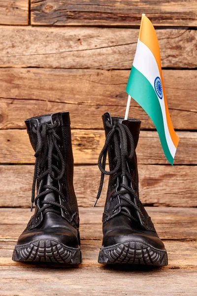 Pair of soldier army boots and flag of india.