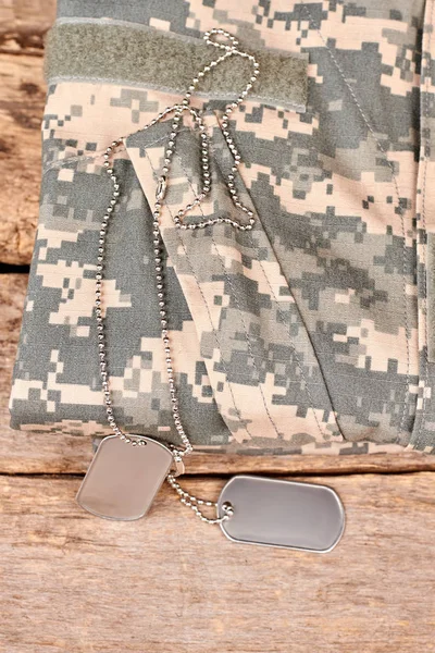 Soldier camouflage clothes and dog tags. — Stock Photo, Image