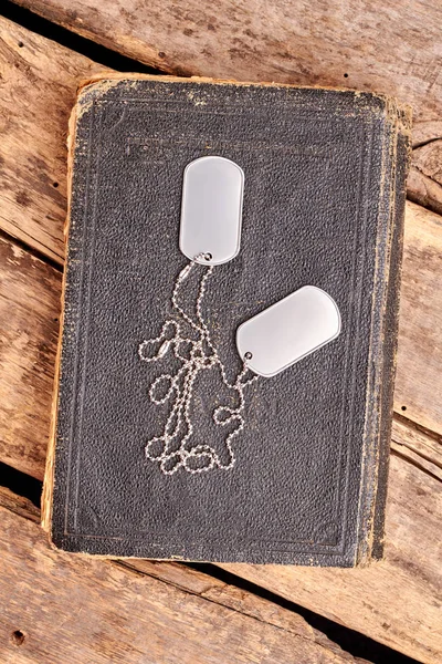 Old book and dog tags.