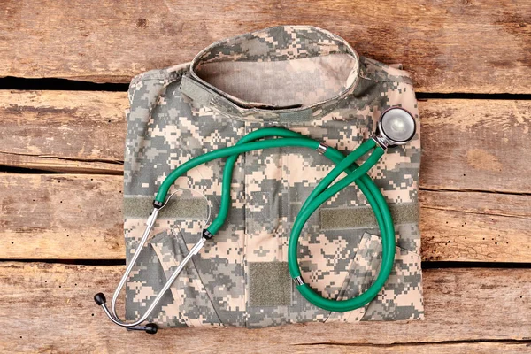 Military clothes and stethoscope. — Stock Photo, Image