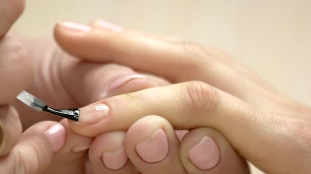 Polish applying by manicurist close up. — Stock Video