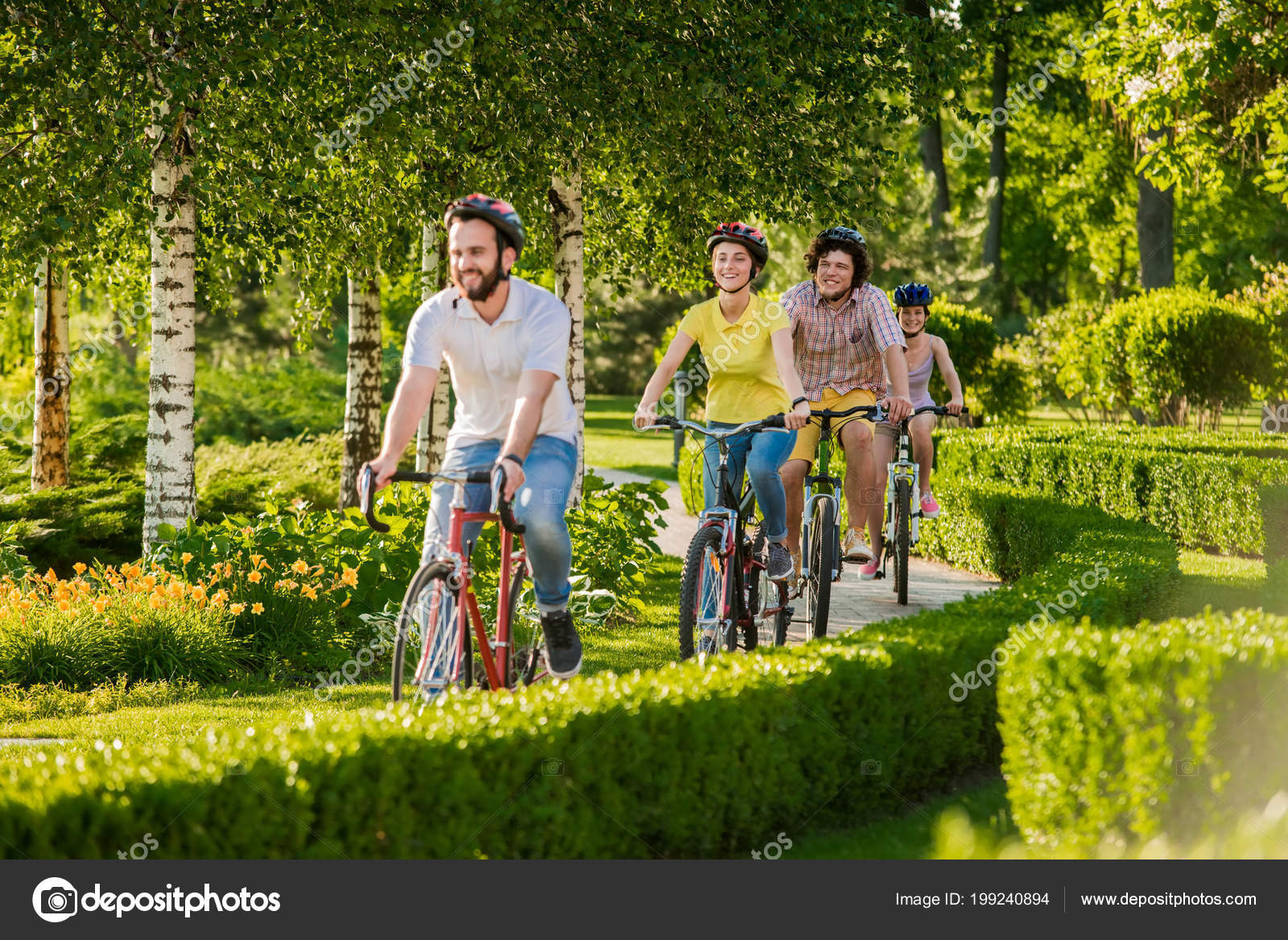 Happy Friends Cycling In City Park Stock Photo Happy Friends Cycling In City Park Stock Photo