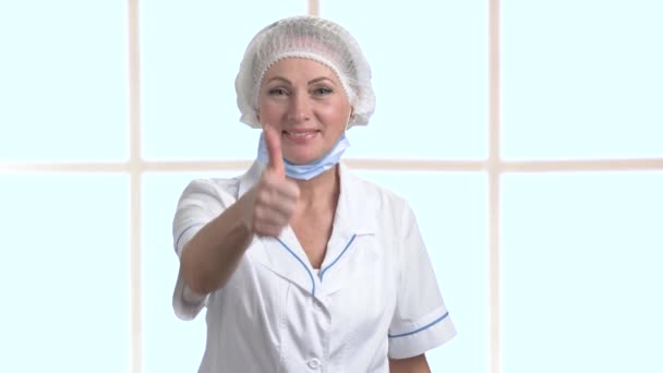 Happy woman doctor giving thumb up sign. — Stock Video