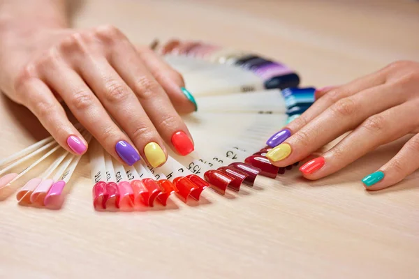 Female manicured hands, nails samples.