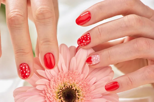 Female gentle manicure and flower. — Stock Photo, Image