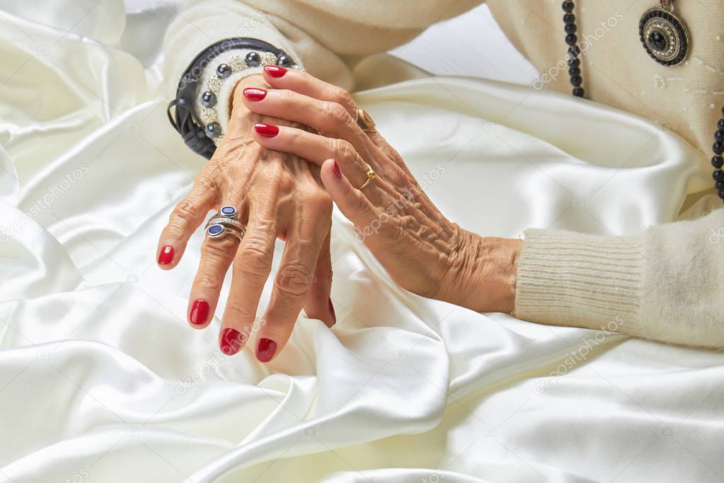 Old woman luxury hands with manicure.