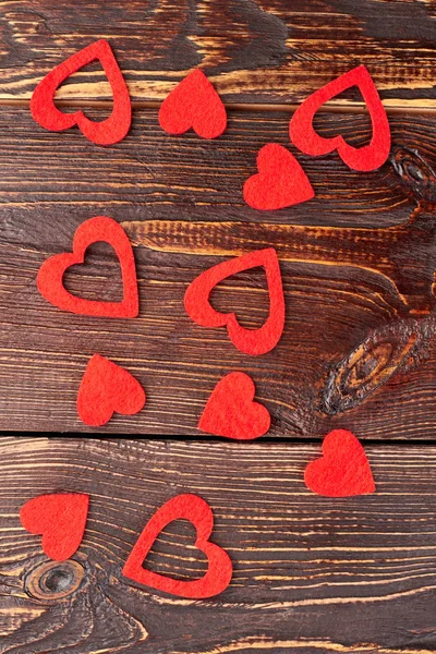 Fondo de madera con corazones rojos, vista superior . — Foto de Stock