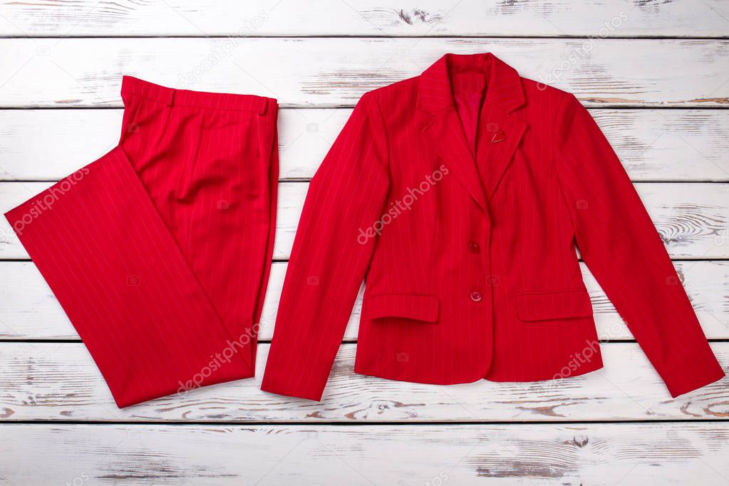 Flat lay red women suit.
