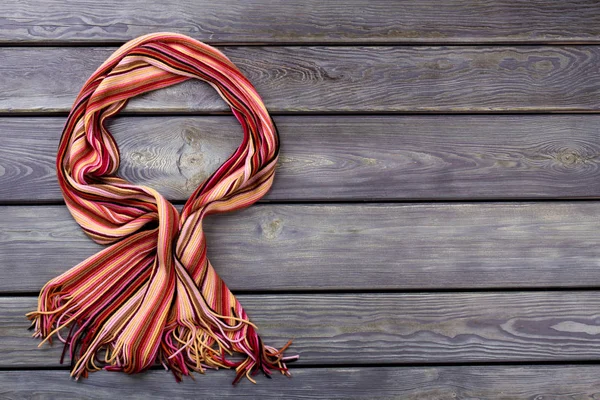 Bowed colourful wool scarf. — Stock Photo, Image