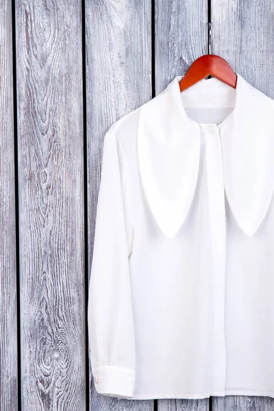 Flat lay white female shirt with long collar. — Stock Photo, Image