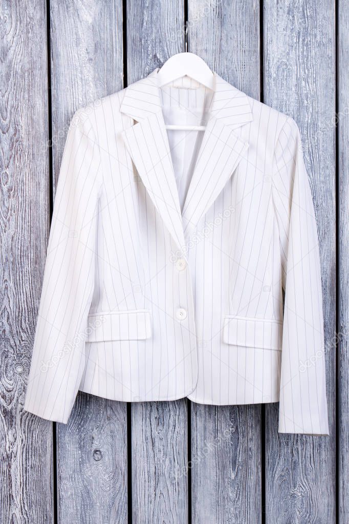 White business jacket with stripes.