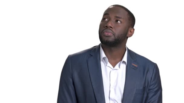 Portrait of black businessman looking up and thinking. — Stock Video