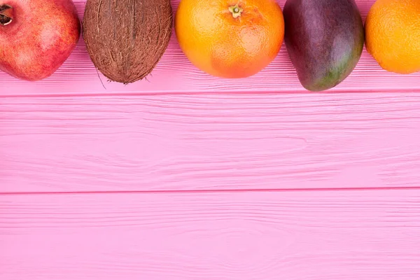 Row of exotic fruits and copy space.