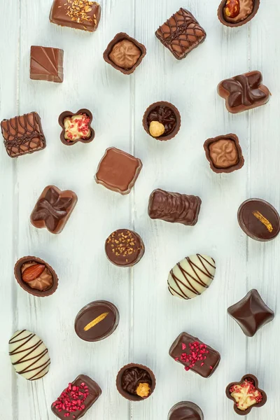 Assorted chocolate sweets background.