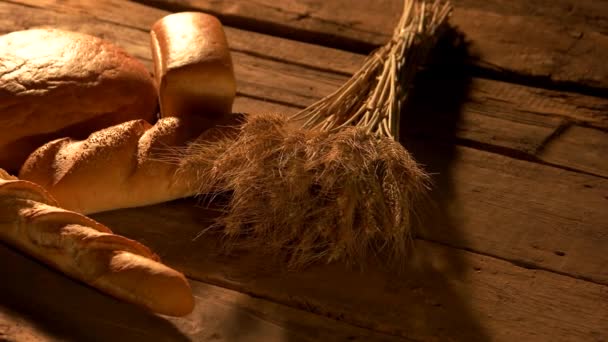 Homemade bread on rustic wooden background. — Stock Video