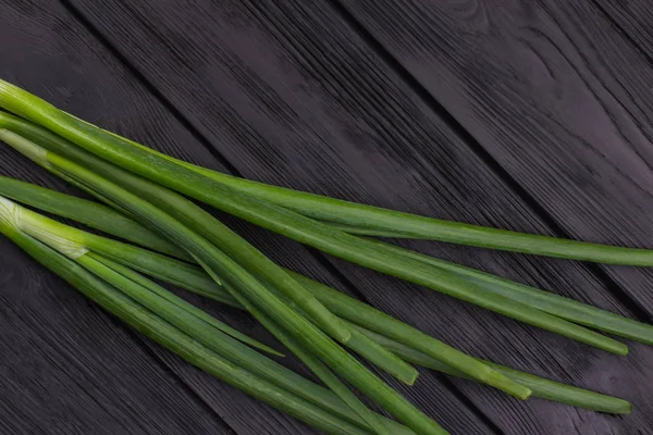 Bunch of green onion on dark background. — Stock Photo, Image