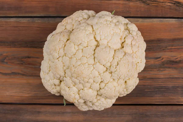 Fresh raw cauliflower on wood. — Stock Photo, Image