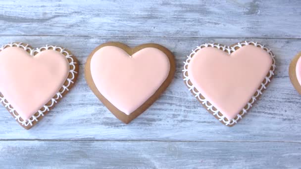 Row of heart shaped biscuits. — Stock Video