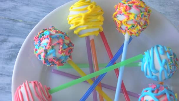 Colorful glazed sweets on sticks. — Stock Video