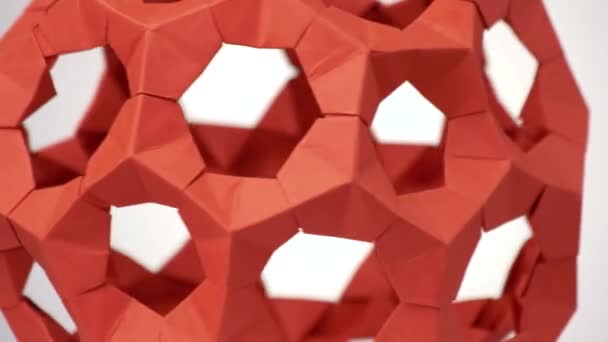 Nahaufnahme rotes rotierendes modulares Origami. — Stockvideo