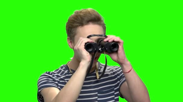 Boy looking through binocular. — Stock Video
