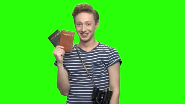 Young tourist boy with shows passports. — Stock Video