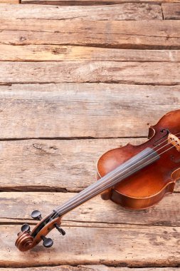 Violin on wooden planks and copy space. clipart