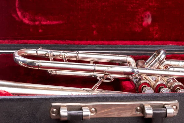 Close up old trumpet in velvet case.