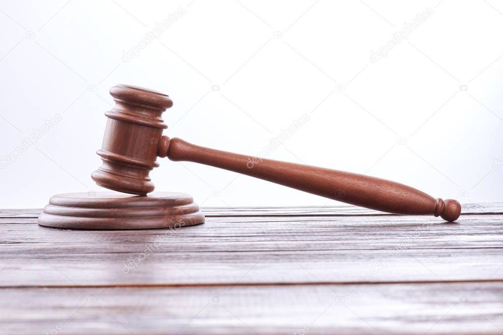 Judge gavel on wooden table.