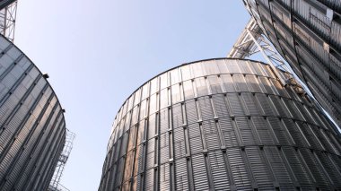 Metal agriculture storage silos. clipart