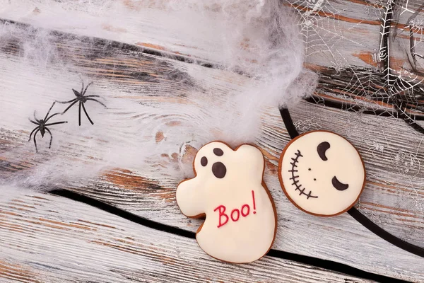 Halloween holiday decorations on wooden background.