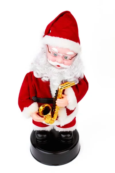 Schönes Weihnachtsmann-Spielzeug mit Saxophon. — Stockfoto
