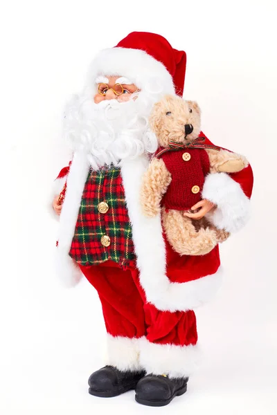 Papai Noel boneca segurando urso de pelúcia . — Fotografia de Stock