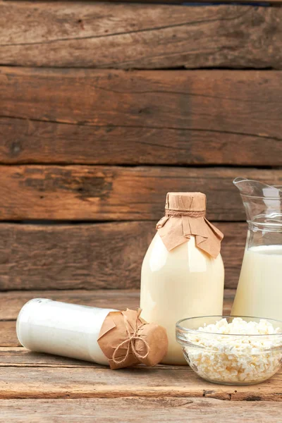 Eco milk products on wooden background.