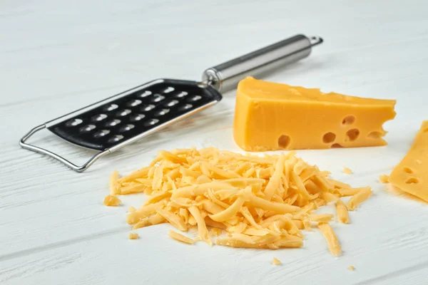 Cheese and grater on white background. — Stock Photo, Image