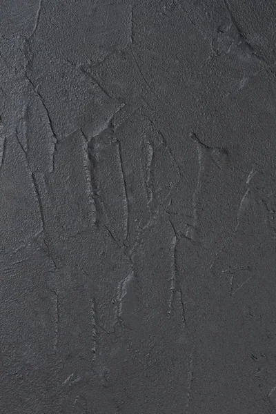 Black slate stone background.