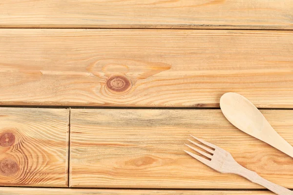 Wooden fork and spoon with copy space. — Stock Photo, Image