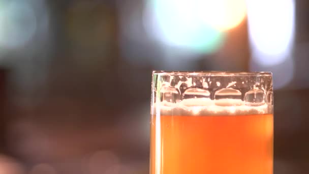 Thick orange beer head. — Stock Video