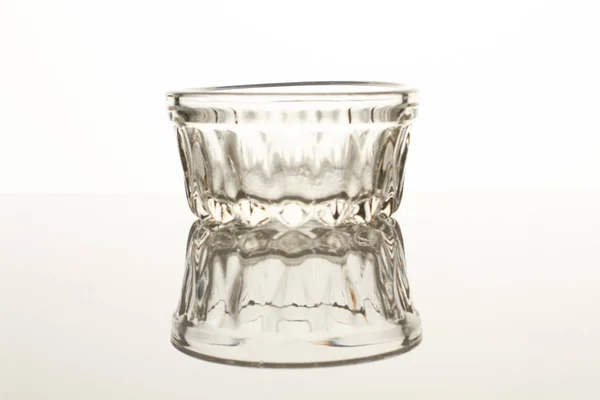 Transparent, small, glass cup on white background. — Stock Photo, Image